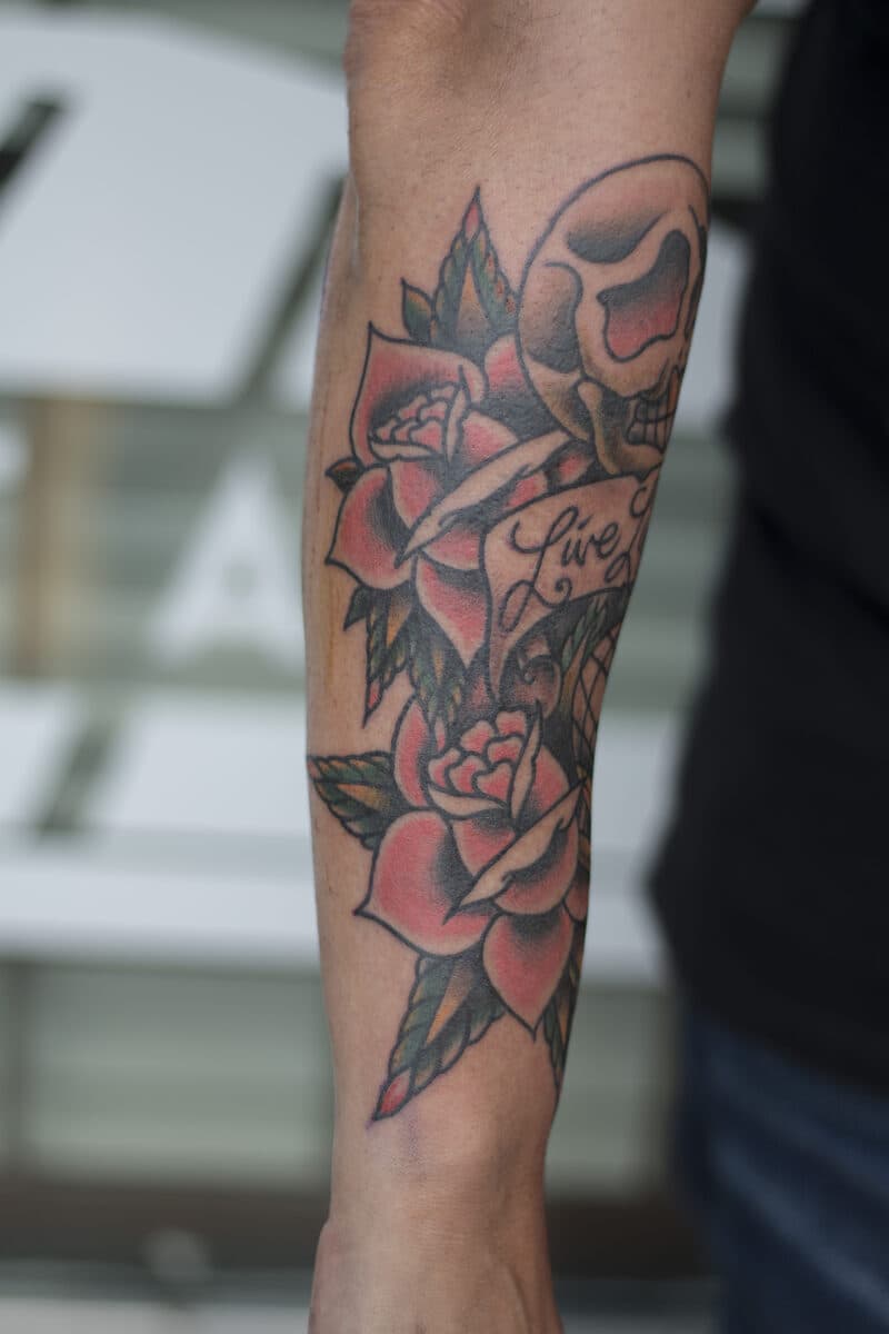 Skull, roses & banner — forearm